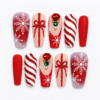 Red snowflake press-on nails with glitter bows, candy-cane stripes, jewel-like accents and white details