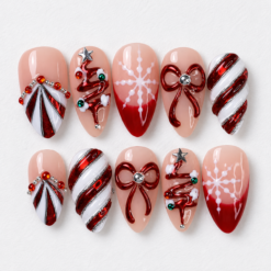 Red and white Christmas press-on nails in blush and burgundy with tree art, candy-cane stripes, snowflakes, bows and rhinestone-style accents