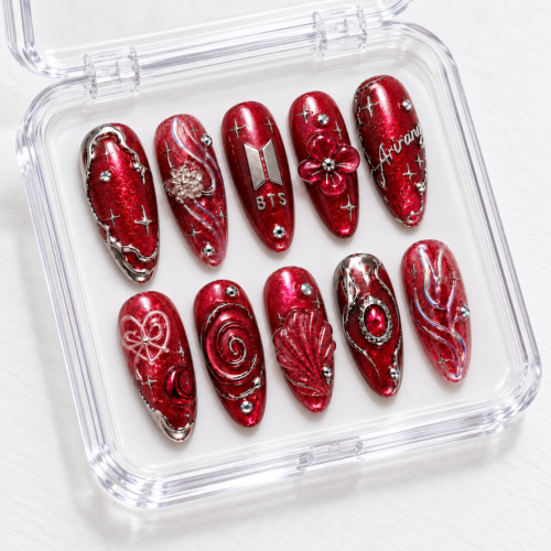 press-on nails with silver-toned details, gem-like accents