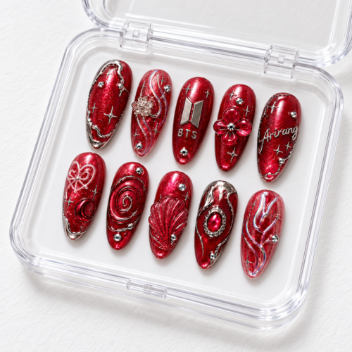 press-on nails with silver-toned details, gem-like accents