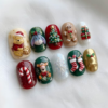 Storybook christmas press-on nails with festive animal characters, a Christmas tree, gingerbread, gifts and candy canes.