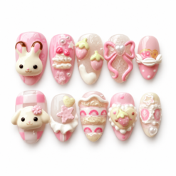 Press-on nails with 3D bunny and puppy faces, strawberries, dessert details, a pink bow, and pearl-like beads.