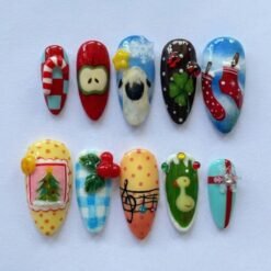 Christmas stockings press-on nails in red, blue and yellow with stockings on a line, a 3D candy cane, a sheep and a duck
