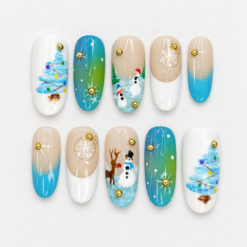Watercolor winter press-on nails with snowy trees, snowmen, a reindeer, snowflakes and gold accents.