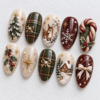 press-on nails in cream, forest green and deep burgundy