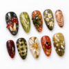 featuring spotted mushrooms, leafy branches, flowers press on nails