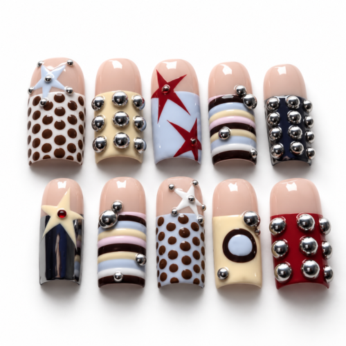 stars, geometric color blocks and raised silver-tone studs on a nud press on nails