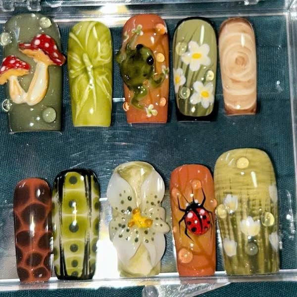 Ra***l wearing Woodland Mushroom Ladybug Press-On Nails