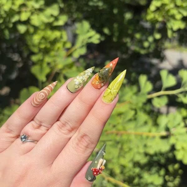 Ga**y wearing Woodland Mushroom Ladybug Press-On Nails