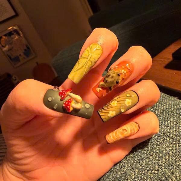 Ca***n wearing Woodland Mushroom Ladybug Press-On Nails