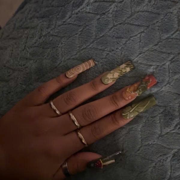 Ro***i wearing Woodland Mushroom Ladybug Press-On Nails