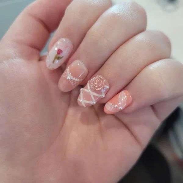 Ol***a wearing Pink Rose Lace Bow Floral Press-On Nails